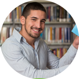 image of Smiling Student. man with beard in a library